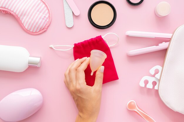 Top view hand holding menstrual cup