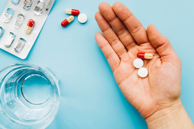 Top view hand holding pills