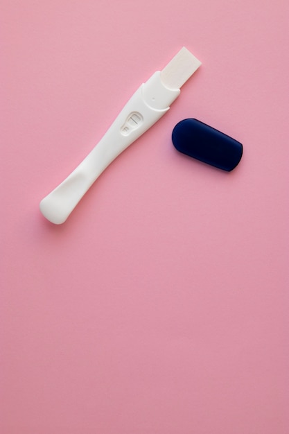 Top view hand holding pregnancy test