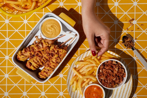 Top view hand taking fries