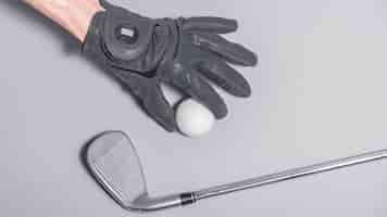 Free photo top view hand with golf ball