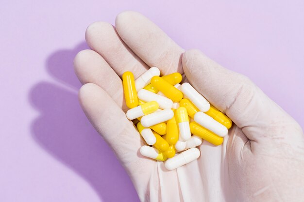 Free photo top view hand with pills