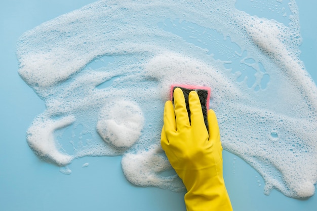 Top view hand with rubber glove cleaning