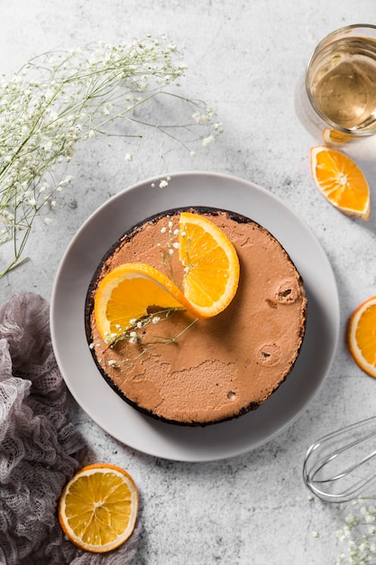 Top view handmade cake with orange slices on top