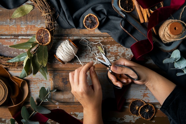 Top view hands assembling  advent wreath