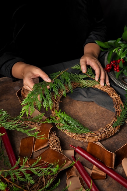 Top view hands assembling  advent wreath