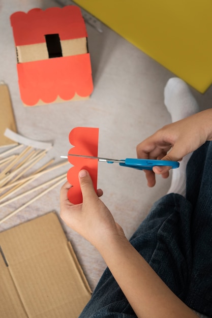 Top view hands cutting with scissors