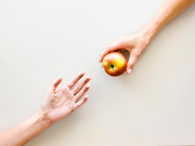 Top view of hands exchanging food