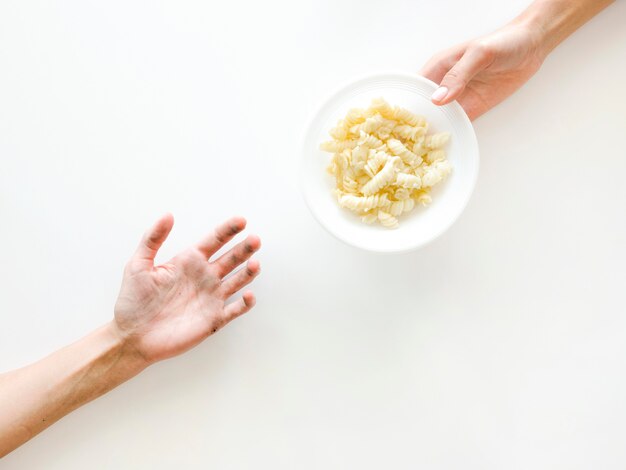 Top view of hands exchanging food