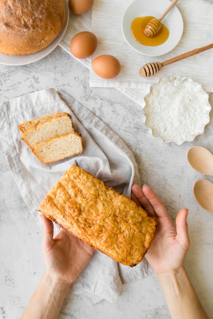 Top view hands holding banana bread