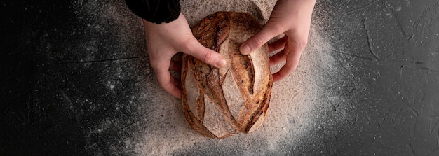 Top view hands holding bread