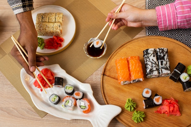 Top view hands holding chopsticks