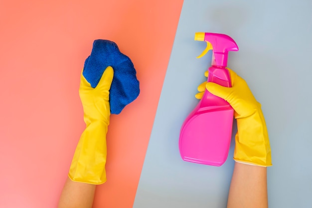 Top view hands holding cleaning equipment