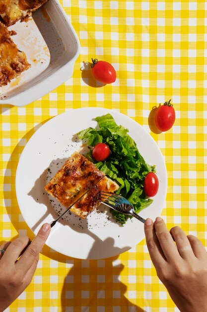 Top view hands holding cutlery