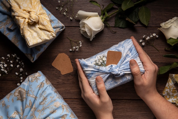 Top view hands holding  furoshiki package