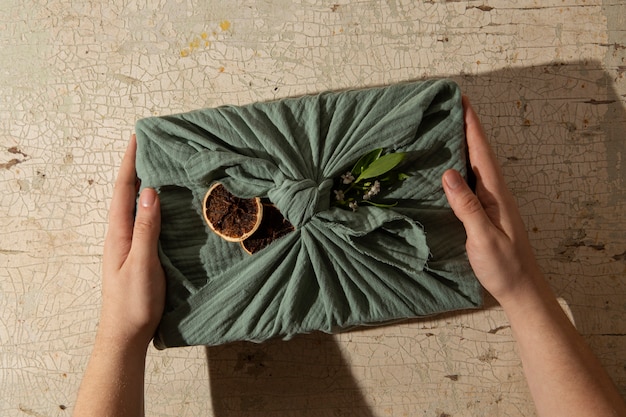 top view hands holding  furoshiki package