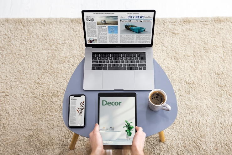 Free Photo top view hands holding tablet