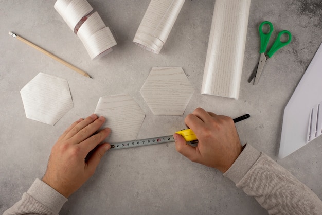 Top view hands measuring vinyl