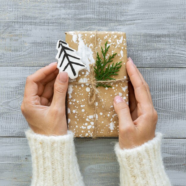 Top view of hands with christmas gift