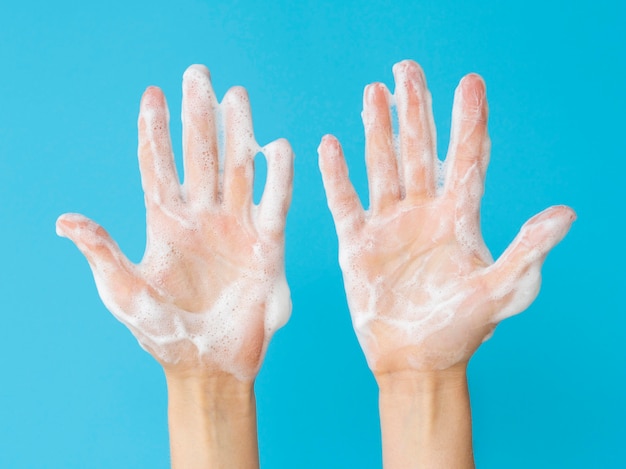 Top view of hands with foam from soap