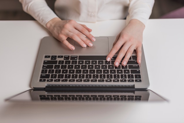 Top view of hands with laptop