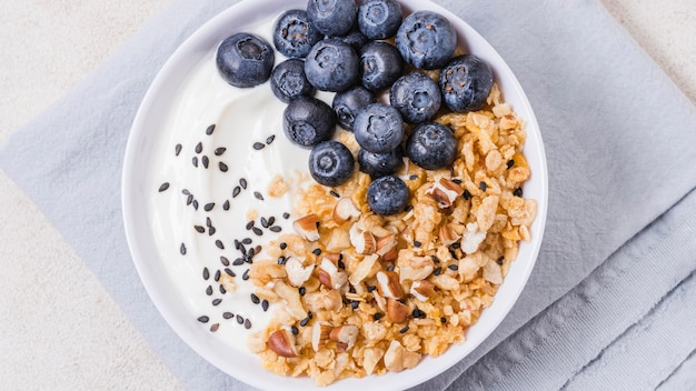Top view healthy breakfast bowl with blueberries