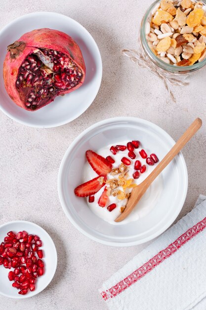 Top view healthy breakfast bowl with pomegranate seeds