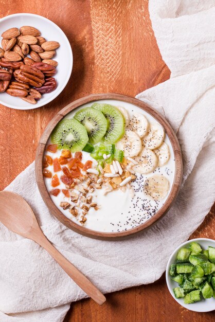 Top view healthy breakfast bowl with yogurt and fruits