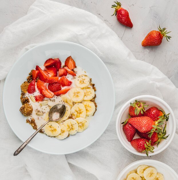 Top view healthy breakfast with strawberries