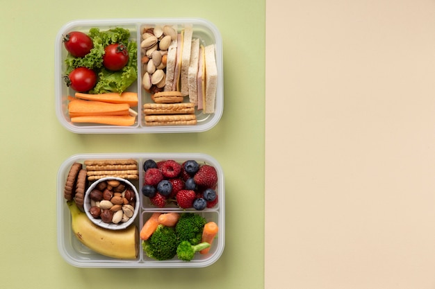 Top view healthy food lunch boxes arrangement