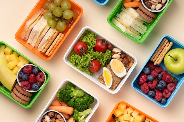 Top view healthy food lunch boxes assortment