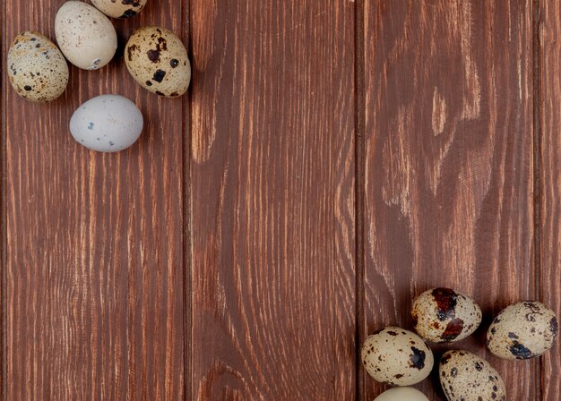 Top view of healthy fresh quail eggs on a wooden background with copy space