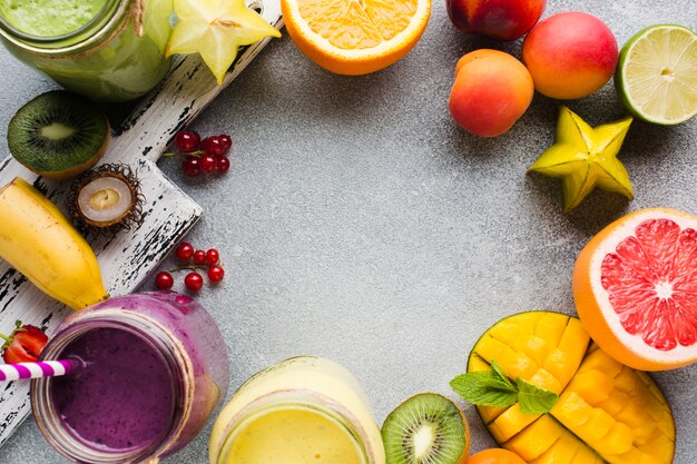 Top view healthy fruit smoothies frame