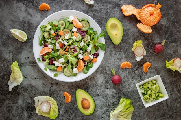 Top view healthy salad with vegetables and fruit