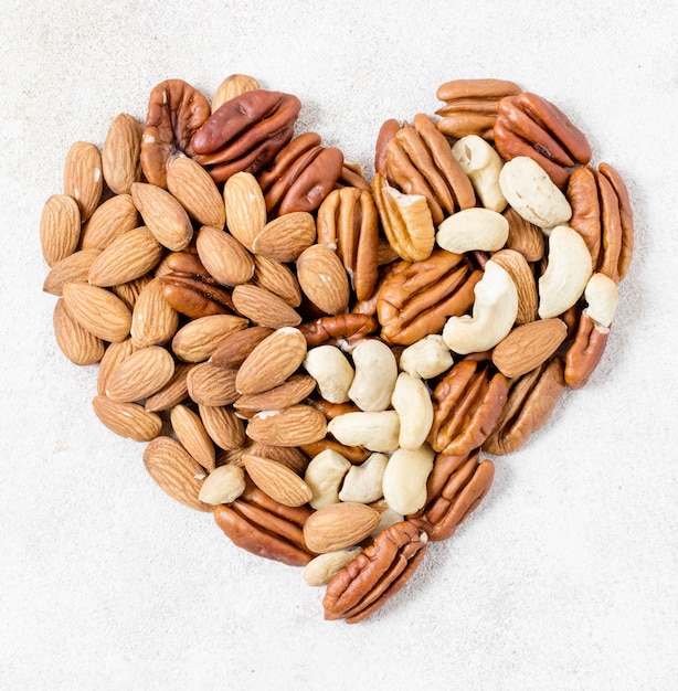 Top view of heart made of walnuts and almonds