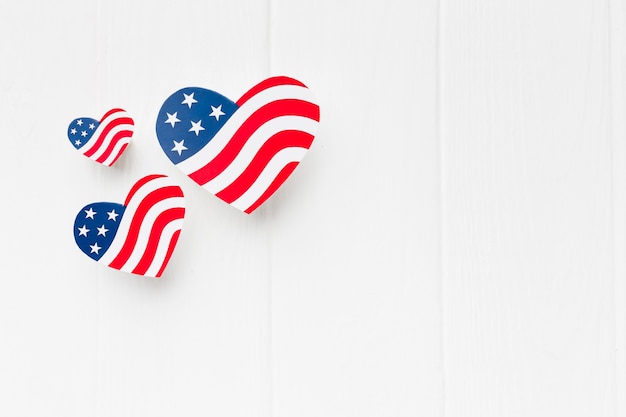 Top view of heart-shaped american flags with copy space