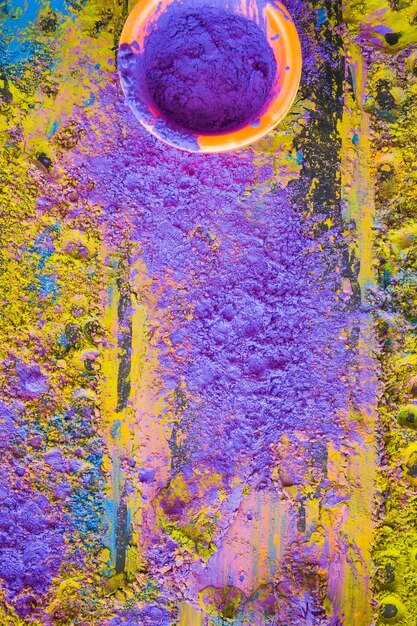 Top view of holi festival powder in bowl with background