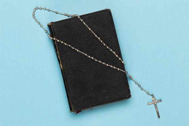 Top view holy book and necklace
