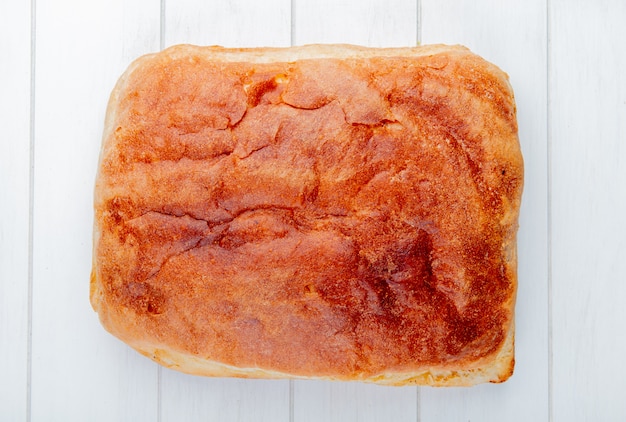 Free photo top view of homemade bread on wooden table