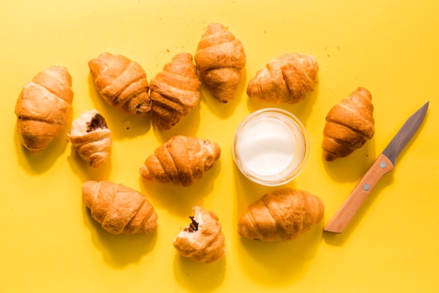 Top view homemade croissants with organic milk