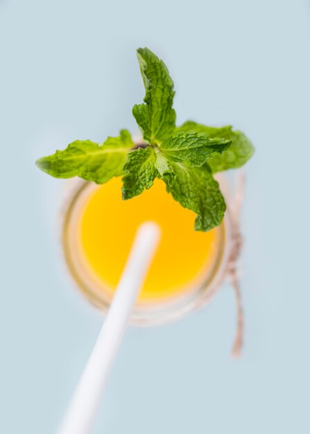 Top view homemade orange juice with mint