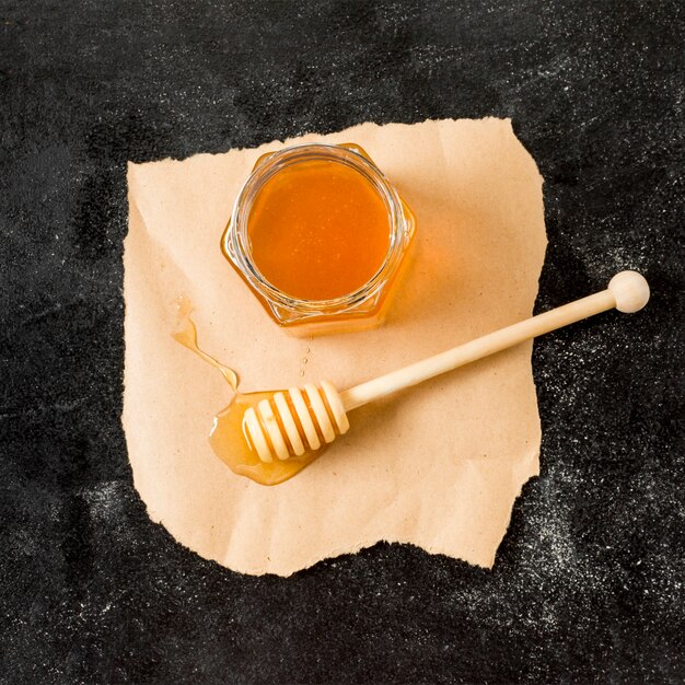 Top view honey jar with spoon