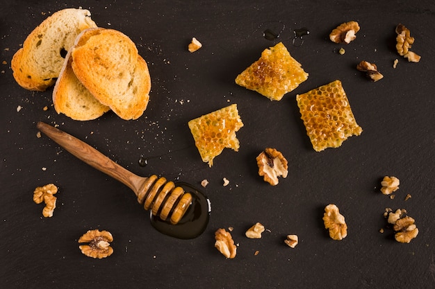 Free photo top view honey with honeycomb pieces