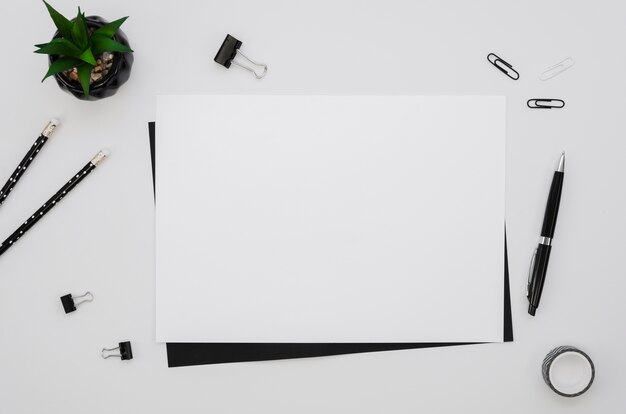 Top view of horizontal paper with office supplies
