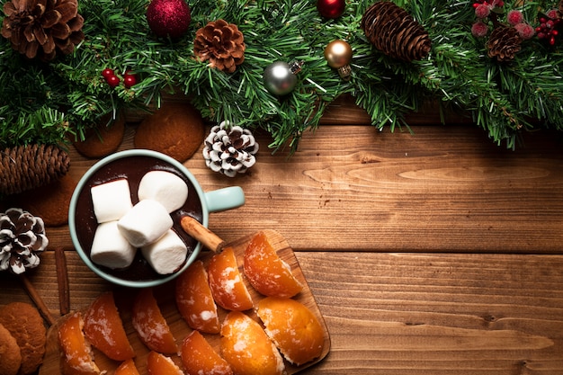 Top view hot chocolate with wooden background