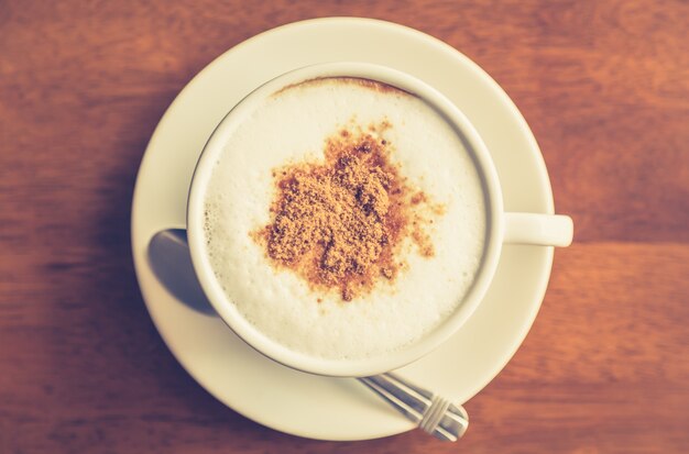 Top view of hot coffee with cinnamon