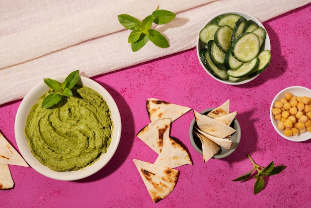 Top view hummus and cucumber arrangement