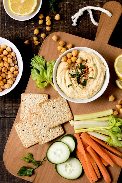 Top view of hummus with different vegetables