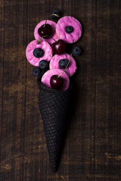 Top view ice cream cone with cherries