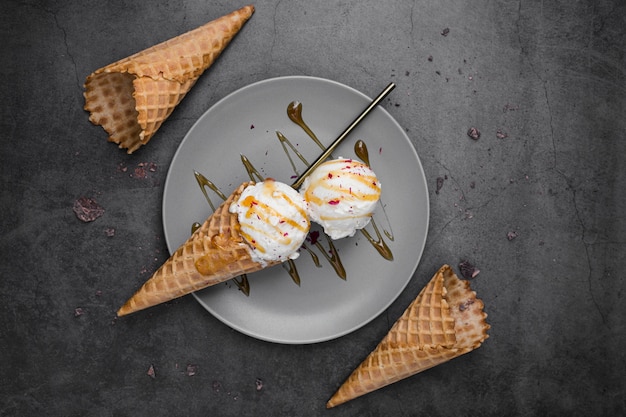 Top view ice cream on cones on plate